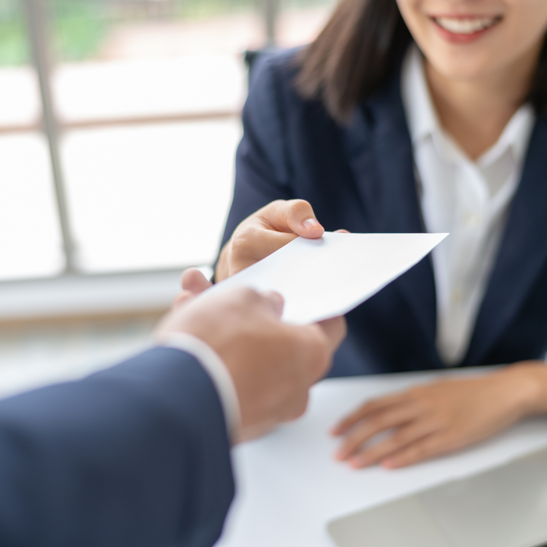 a woman getting her final pay