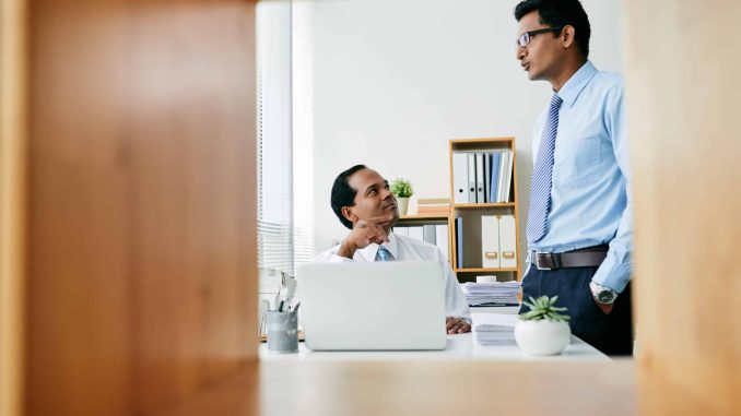 Businessman explaining his new idea to employer